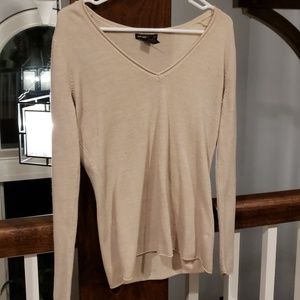 Tan  sweater.